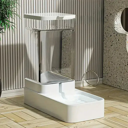 Modern white pet fountain on a wooden floor with a neutral background